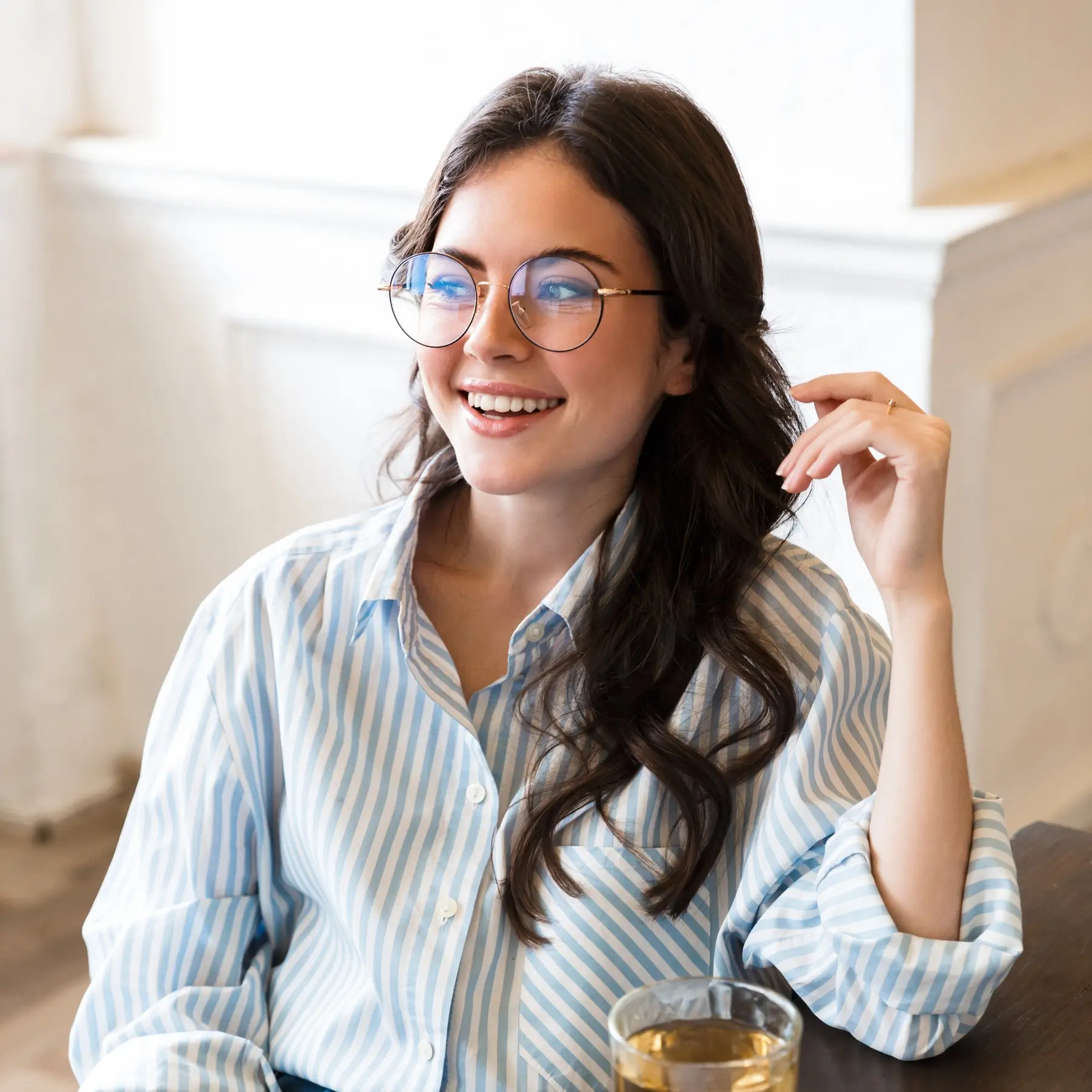 Portrait of Sophie Laurent, Content & Editorial Coordinator at SliceSync, smiling in a bright indoor setting.