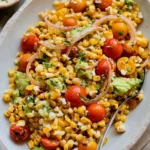 Grilled Corn Salad with avocado, cherry tomatoes, and red onion