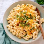 Hawaiian Macaroni Salad (Video) 2 Hawaiian Macaroni Salad in a bowl topped with green onions and paprika seasoning