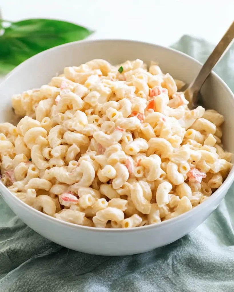 Macaroni Salad for a Crowd served in a large bowl with creamy dressing and elbow macaroni
