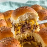 Oven-Baked Cheeseburger Sliders with melted cheese and juicy beef on soft slider buns