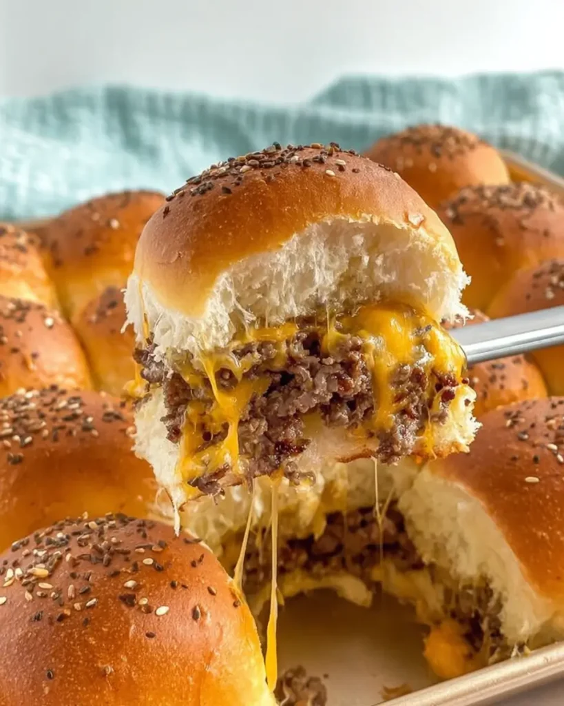 Oven-Baked Cheeseburger Sliders with melted cheese and juicy beef on soft slider buns
