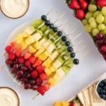 Rainbow Fruit Skewers with strawberries, grapes, pineapple, kiwi, and blueberries