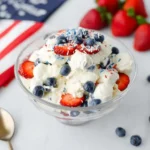 Red White and Blue Cheesecake Salad with strawberries, blueberries, and whipped cheesecake filling